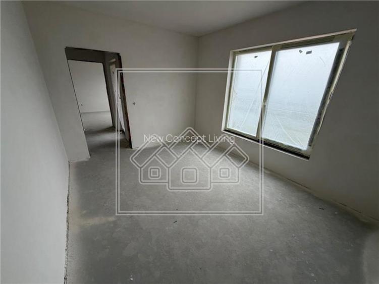 Casa de vanzare - 4 camere - 2 bai - teren 300 mp - Sura Mica - 2