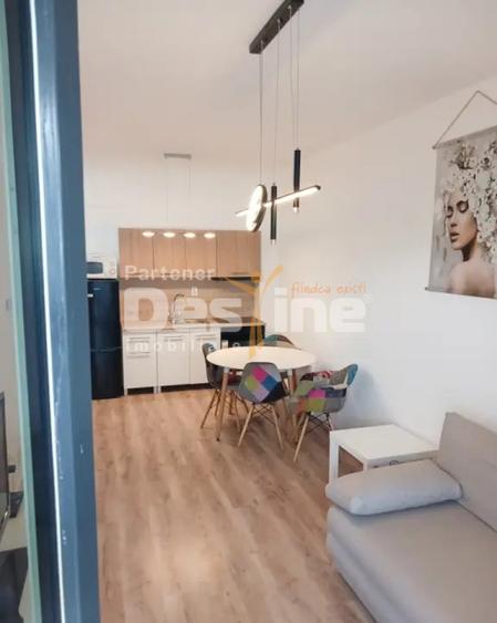 Studio la ertaj intermediar, cu balcon si parcare subterana, situat in Tractorul