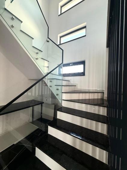 Vilă de vânzare cu design deosebit în cartierul Bucium