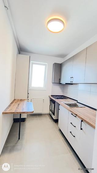 Apartament cu 3 camere, 2 bai si loc de parcare