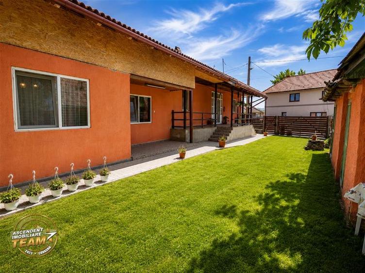 1.200mp teren si casa cu gradina inflorata, aproape de Targu Secuiesc: Belani
