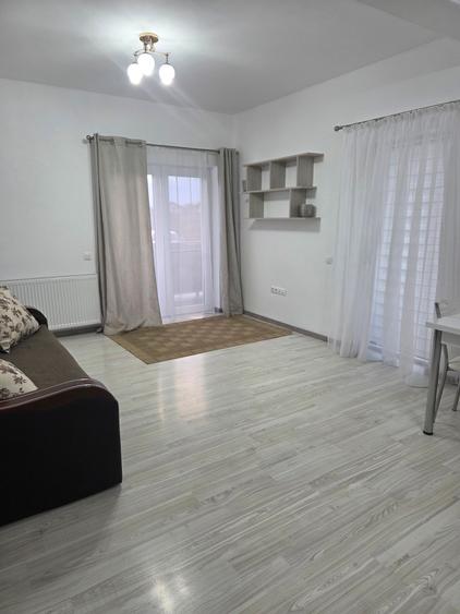 Vand in Unirii,strada Pomilor,apartament cu2 camere,open space,mobilat utilat.