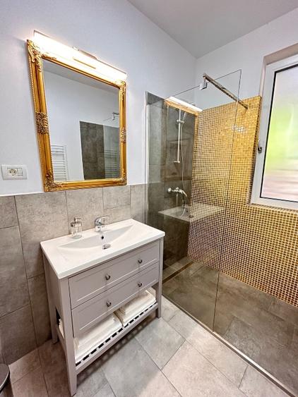 Închiriez apartament 2 camere, cu gradina amenajată in bloc nou.