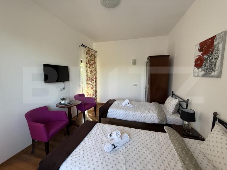 Pensiune cu 4 camere, teren 1590 mp, zona Lazuri