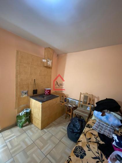Casa batraneasca, locuibila cu teren intravilan de 1.255mp, asfalt