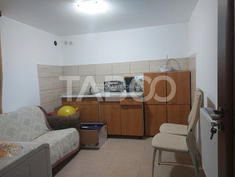 Casa in zona centrala 5 camere 2 bucatarii 3 bai curte comuna Cisnadie