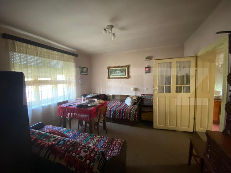 Casă cu teren 10 ari, 2 anexe și dublu front stradal – Beclean