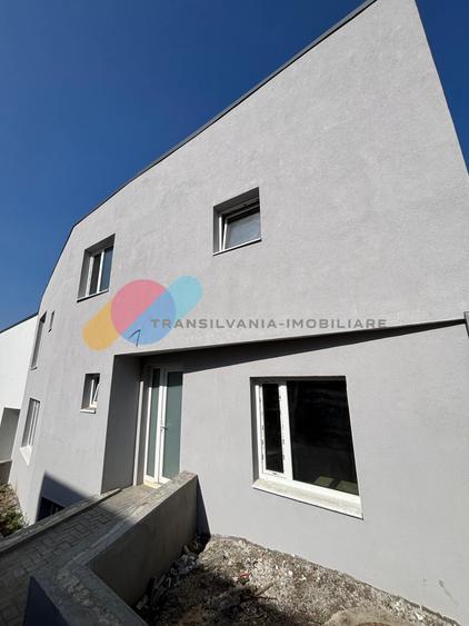 Casă cuplată modernă, 160 mp utili, semifinisată, curte amenajată