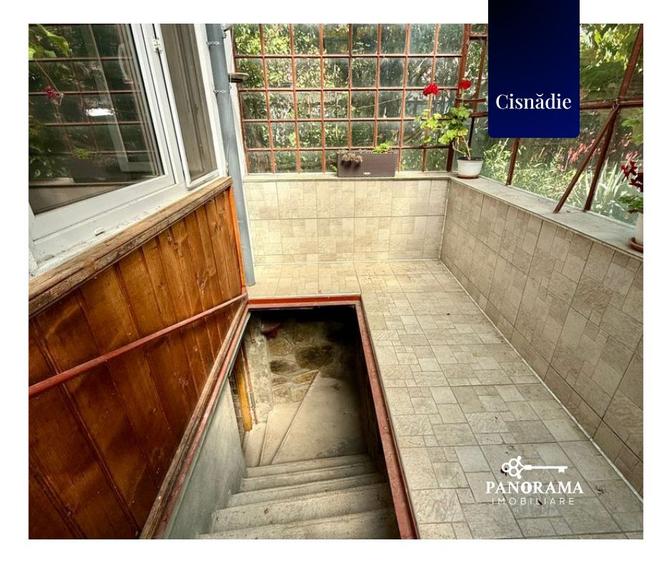 Casă cu grădină proprie, garaj, pivniță și teren în centrul Cisnădiei