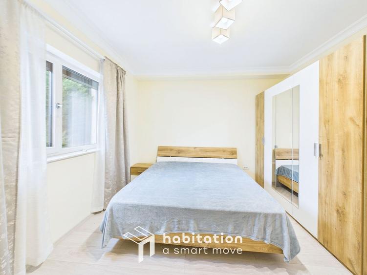 Apartament spațios cu curte și garaj – confortul unei case moderne