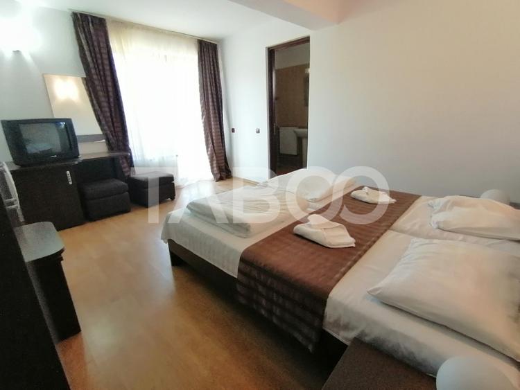 Pensiune 13 camere 16 bai sauna piscina si teren 1565 mp Cisnadioara