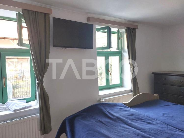 Apartament de vanzare 105 mp 3 camere curte 340 mp in acte Cisnadie