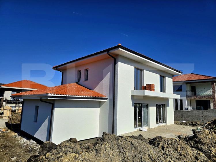 Casă individuală în Chinteni, 120 mp utili, teren de 500 mp, garaj