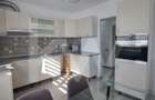 Apartament modern cu 2 camere, curte privată și 2 locuri de parcare