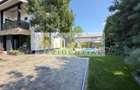 Casa P+1+M cu teren de 650 mp, piscina si curte complet amenajata