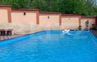 Casa P+1+M cu piscina si 1057 mp de teren, pozitionata inedit - 4
