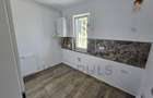 Apartament la parter cu balcon. Bucatarie separata. Loc de parcare - 2