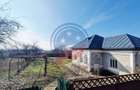 Casa Bradesti  teren  intravilan 7952 mp  deschidere 33 m la DE 70