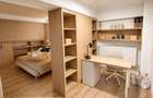 Apartament pe două niveluri cu supantă, mobilier la comandă și loc de parcare