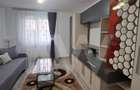 Apartament modern cu 2 camere, curte privată și 2 locuri de parcare