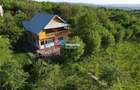 Casa deosebita in mijlocul naturii, cu teren generos si priveliste panoramica - 1