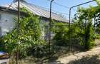 Vand casa batraneasca din caramida acoperita cu tabla mobilata si utilata  - 10