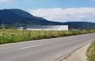 EXCLUSIVITATE-10 ha teren intravilan, curti constructii, front la  DJ  112A - 1