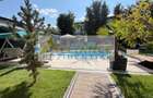 Casa P+1+M cu teren de 650 mp, piscina si curte complet amenajata