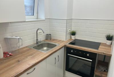 Dacia - Eminescu - Apartament 3 camere demisol/2 etaje - renovat-centrala termic