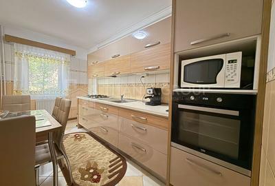 Apartament cu 2 camere, 2 bai, decomandat, etaj 1 - zona Racadau - 1