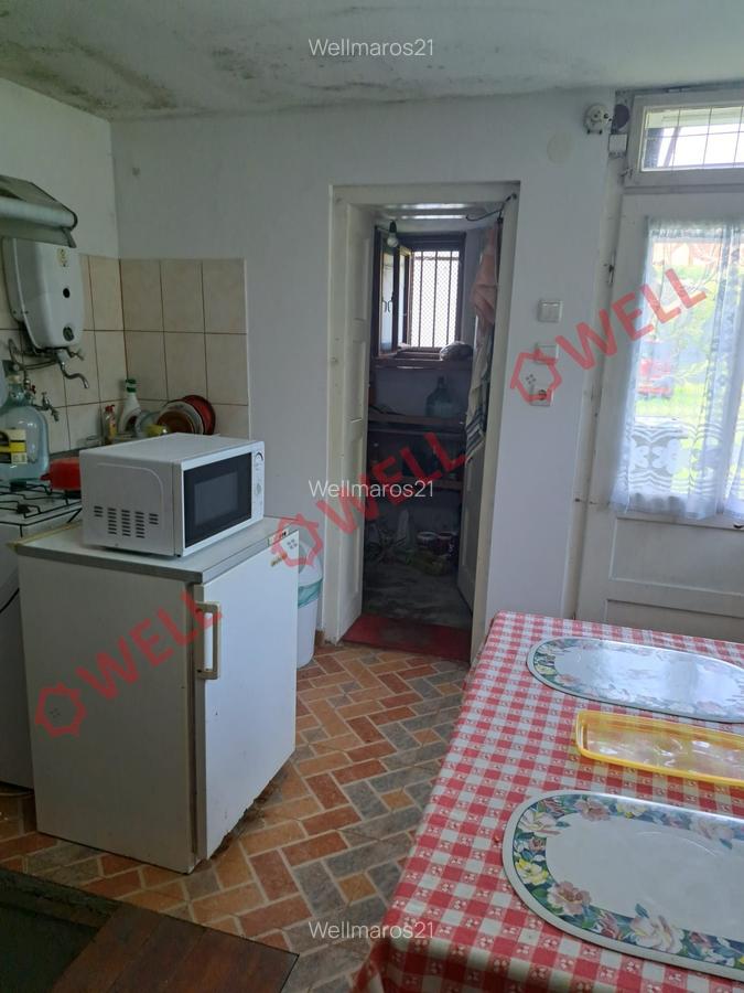 De vânzare în centrul Sovata un teren de 2159 m² cu mai multe case în aceeași cu - 9