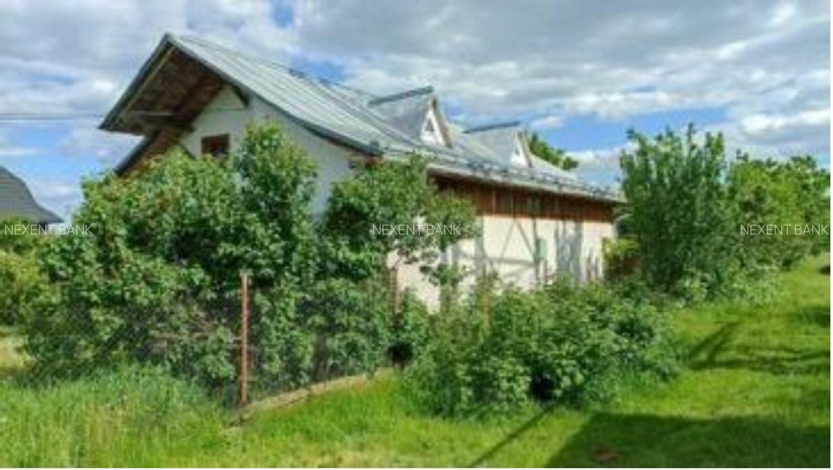 Prorietate  formata din Teren intravilan, casa si teren extravilan - 1