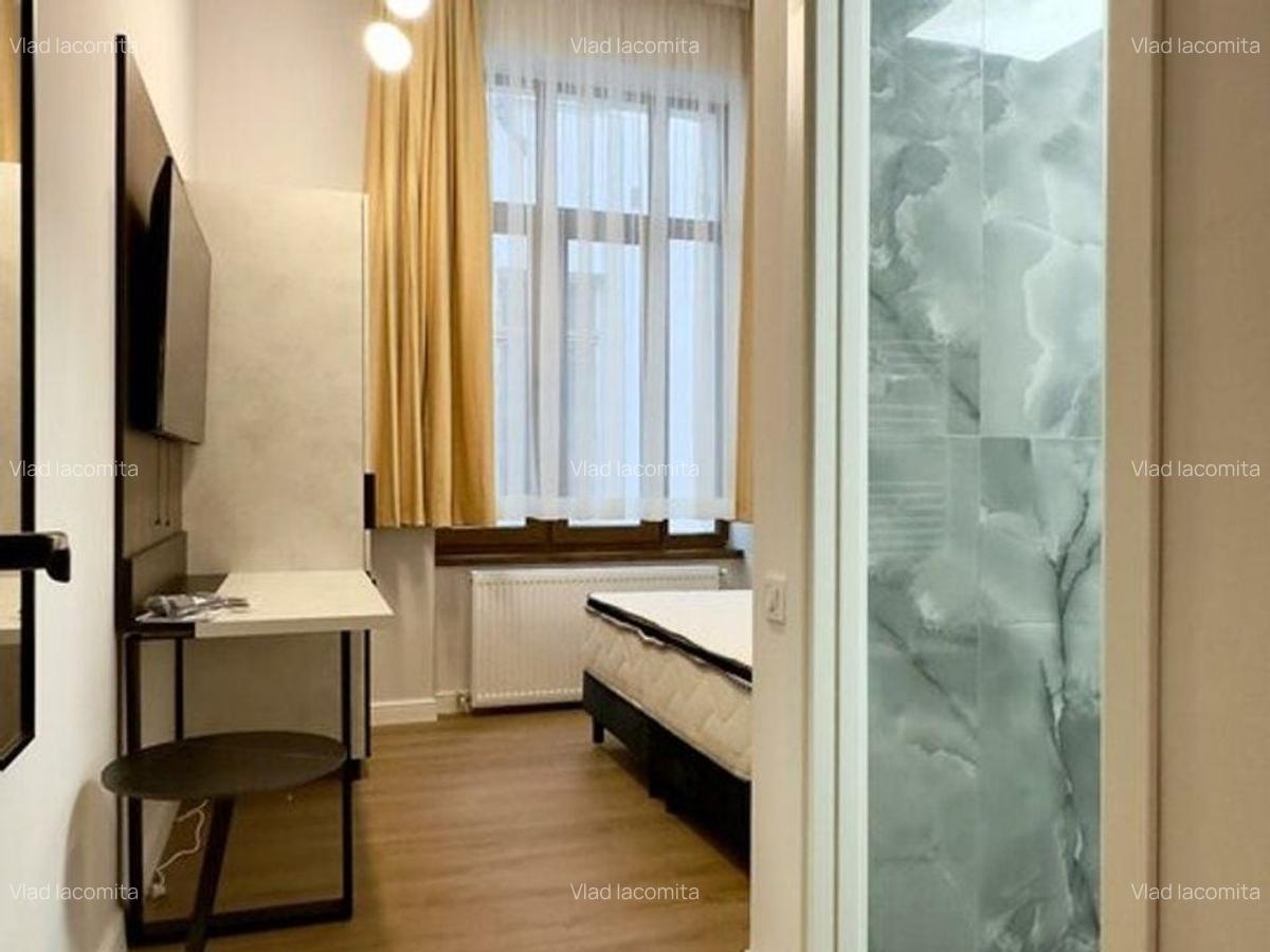 Magheru: 5 camere cu băi proprii - business regim hotelier care deja produce. - 12