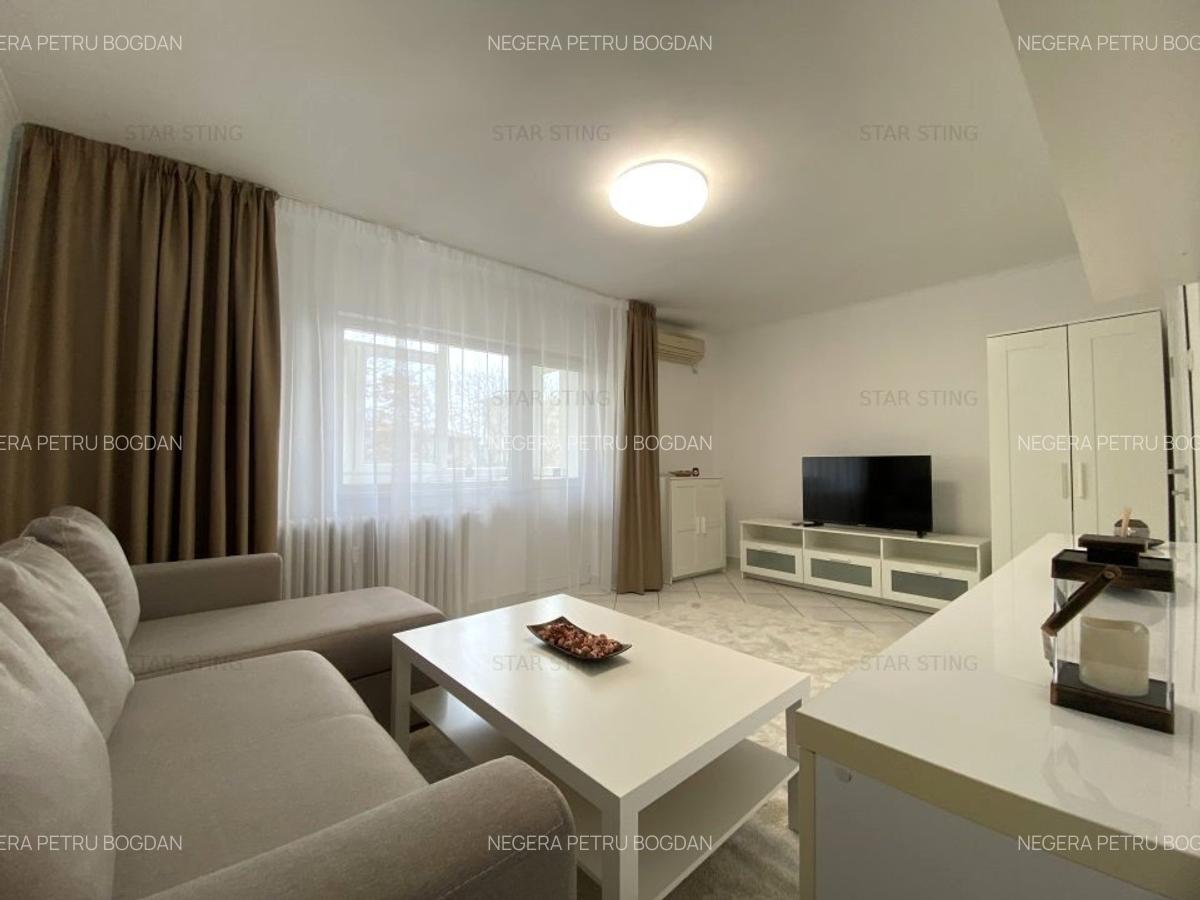 Romana,renovat nou,curat,cu spatii de depozitare. - 1