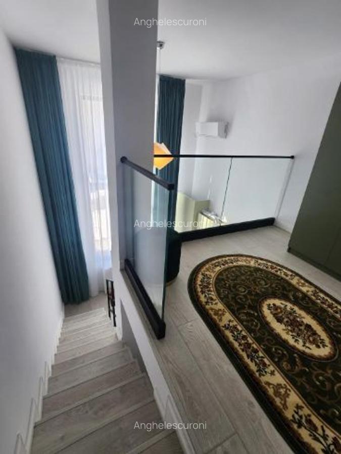 Ofer spre închiriere un studio loft - 3