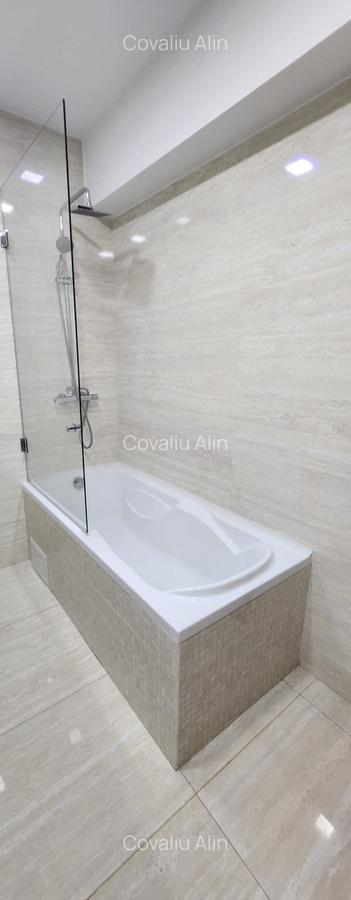 Apartament 2 camere, 2 grupuri sanitare, loc parcare, situat in Tractorul - 17