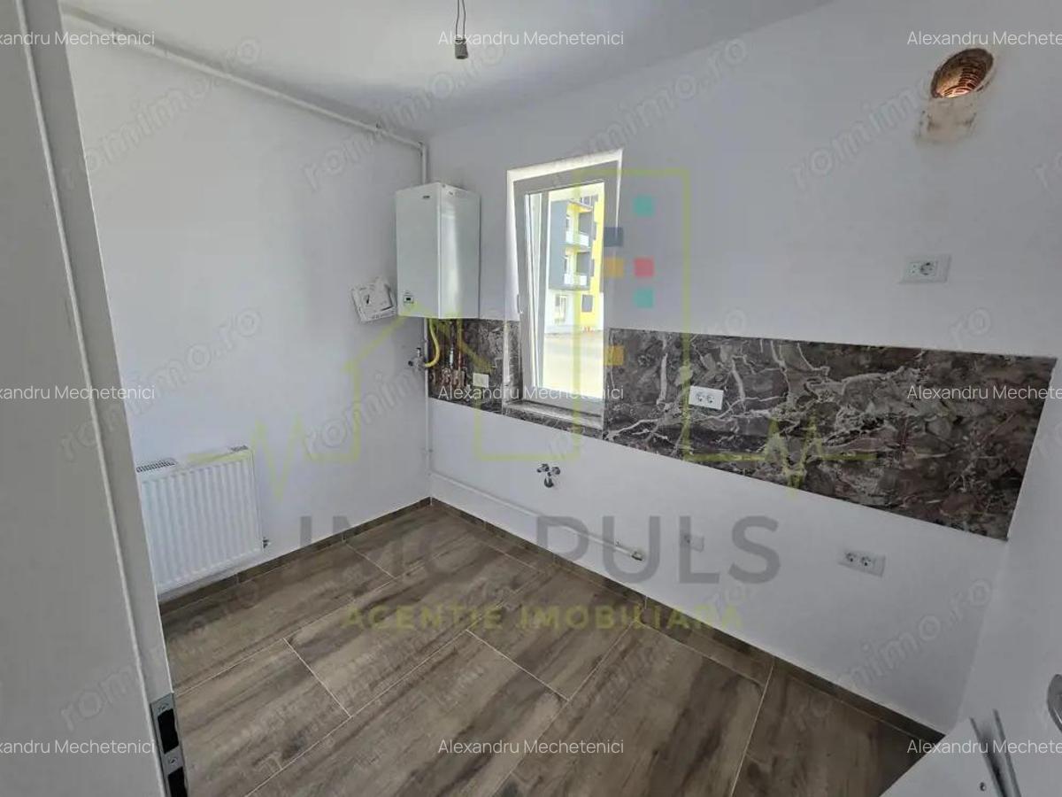 Apartament la parter cu balcon. Bucatarie separata. Loc de parcare - 2