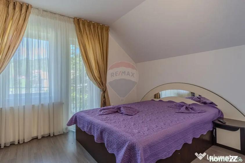 Casă cu 10 camere cu Teren 1074 Mp în Moieciu