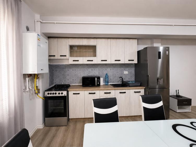Apartament cu 2 camere semidecomandat, mobilat în Baciu