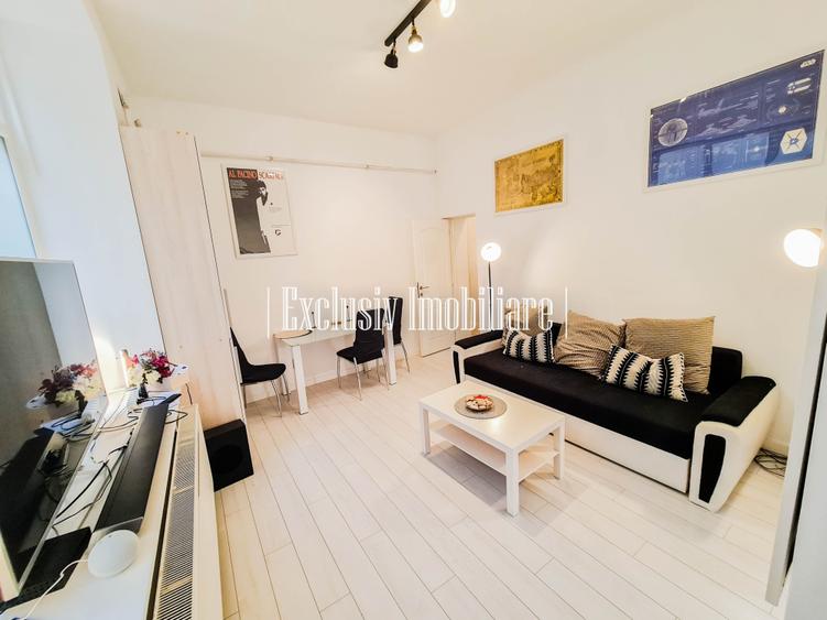 Apartament cu 3 camere semidecomandat, mobilat în Central