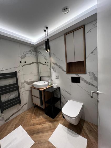 Centrul Civic - apartament 2 camere - balcon 12 mp - loc de parcare subteran - C - 10