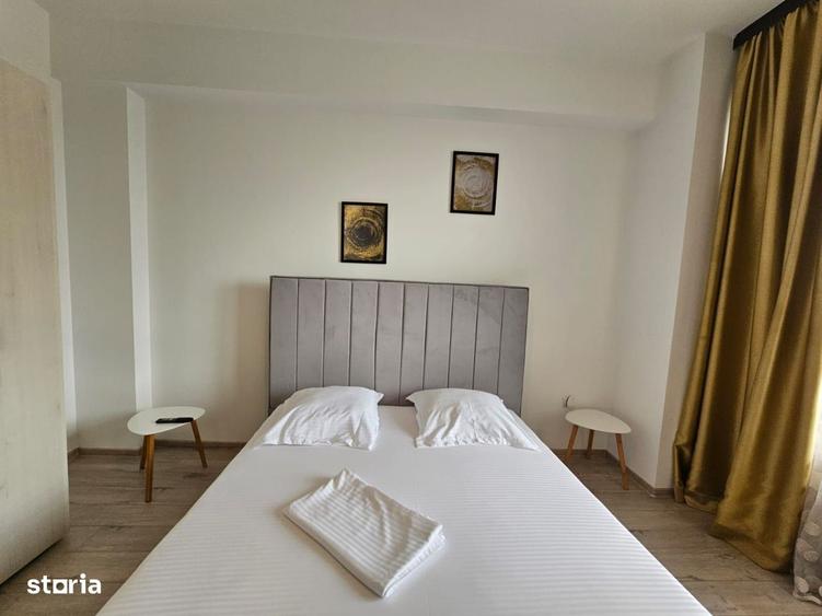 Apartament de vanzare in Summerland vedere laterala catre ac si mare - 4