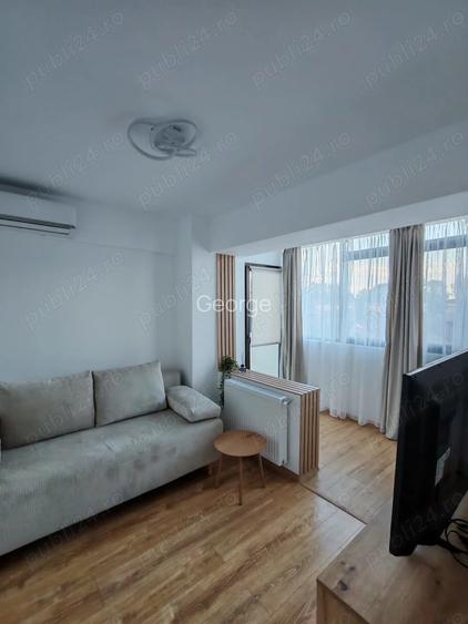 Inchiriez apartament de trei camere decomandat, modern, etaj 2 6, bloc nou, lift, parcare proprie