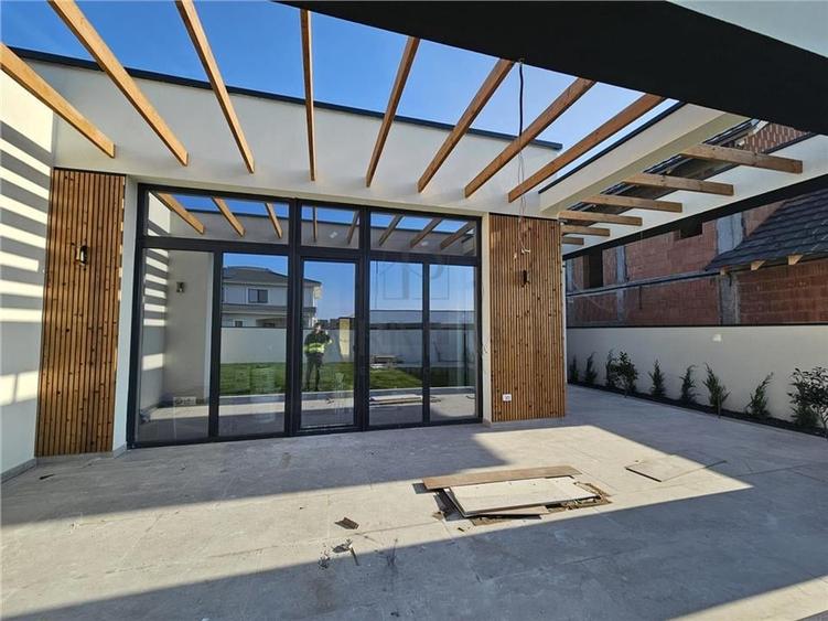 Casa individuala - finalizata - design modern - curte amenejata - 3