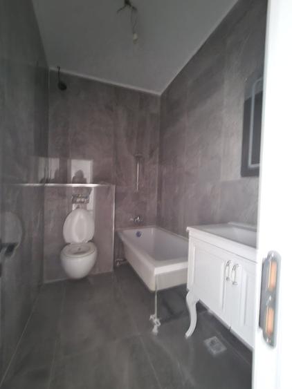 Decebal - Unirii -  Bloc nou - Apartament 3 camere - terasa - 2 grupuri sanitare - 11