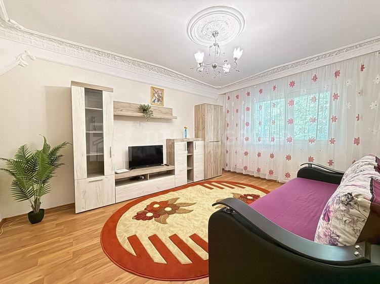 Apartament cu 2 camere, 2 bai, decomandat, etaj 1 - zona Racadau - 1