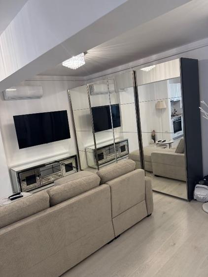 Apartament cu 2 camere semidecomandat, mobilat în Central