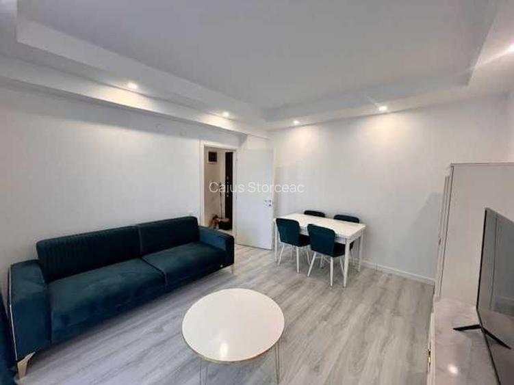 COSMOPOLIS Apartament 2 camere +gradina cu iesire la piscina + PARCARE