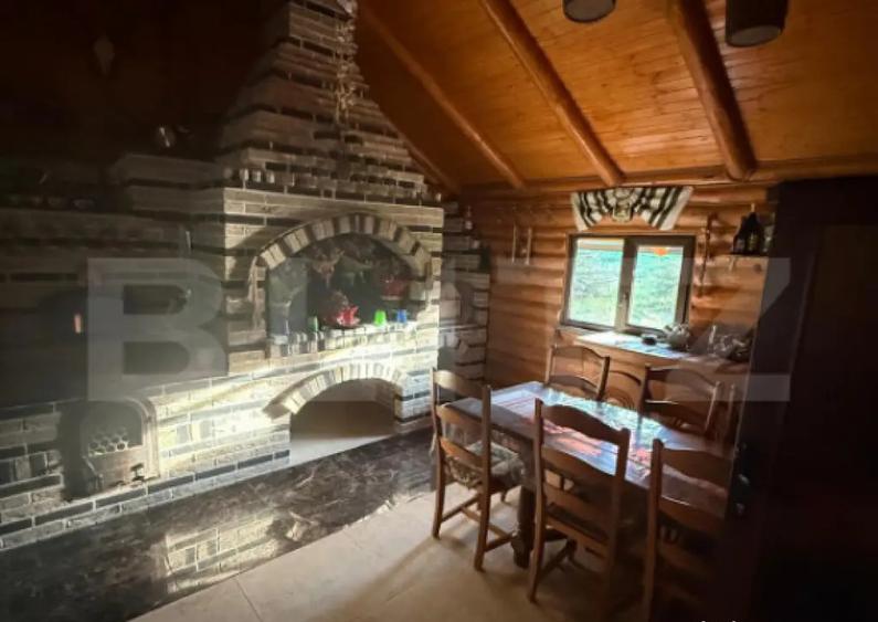 Cabana din lemn rotund, 2 camere, 140 mp, teren 2800 mp, Pal - 18