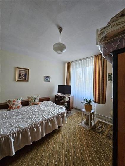 Apartament cu GRADINA SI ACOPERIS  MANSARDA DE VANZARE IN ONESTI ETJ 1 - 6